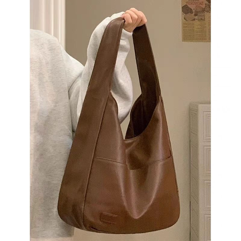 Soft leather tote bag Large capacity brown bucket bag Versatile commuting shoulder bag for women